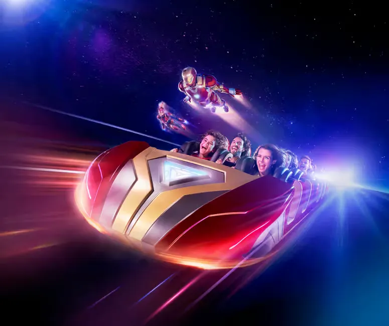 People on a futuristic roller coaster in space scream with excitement. A superhero flies nearby. The setting is vibrant and dynamic.